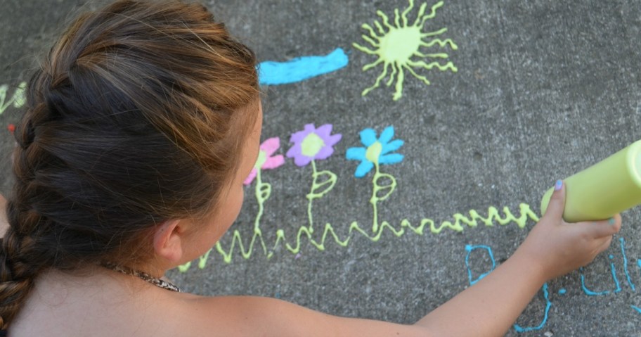girl playing with sidewalk chalk paint