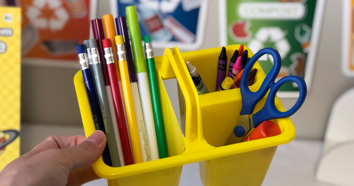 Yellow school supply caddy with pencils, markers, scissors, crayons