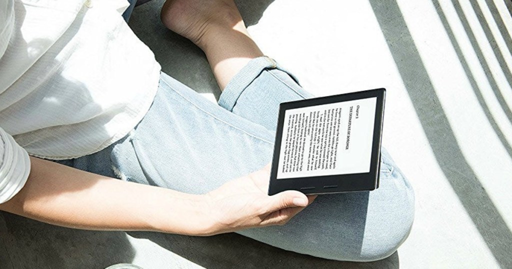 person reading on a Kindle Oasis