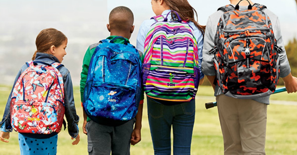 back to school deals at staples, target, and walmart - kids in backpacks walking together