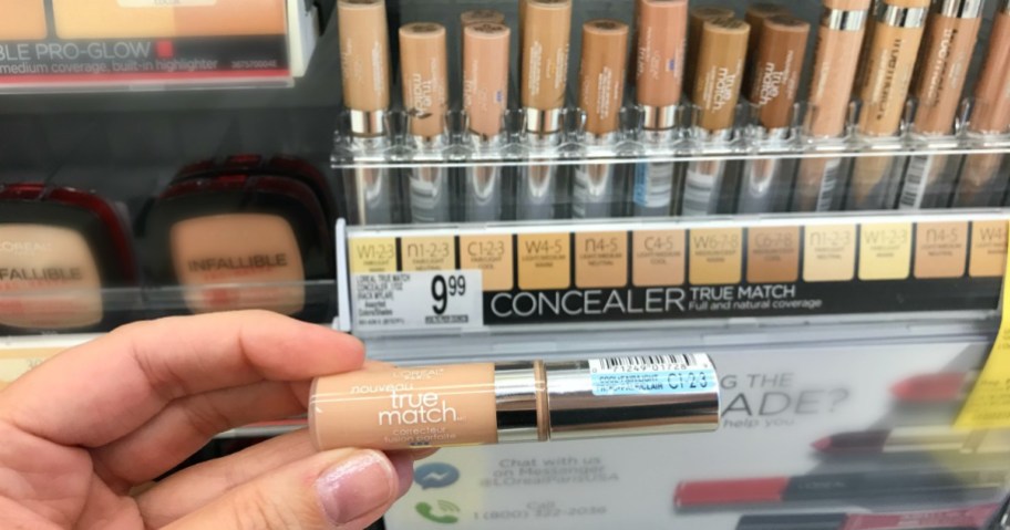 hand holding loreal true match concealer in store