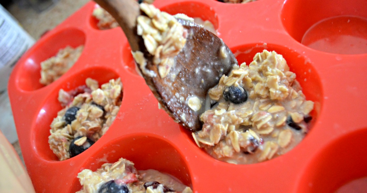Baked Oatmeal Berry Cups – Spooning the batter into a cupcake pan