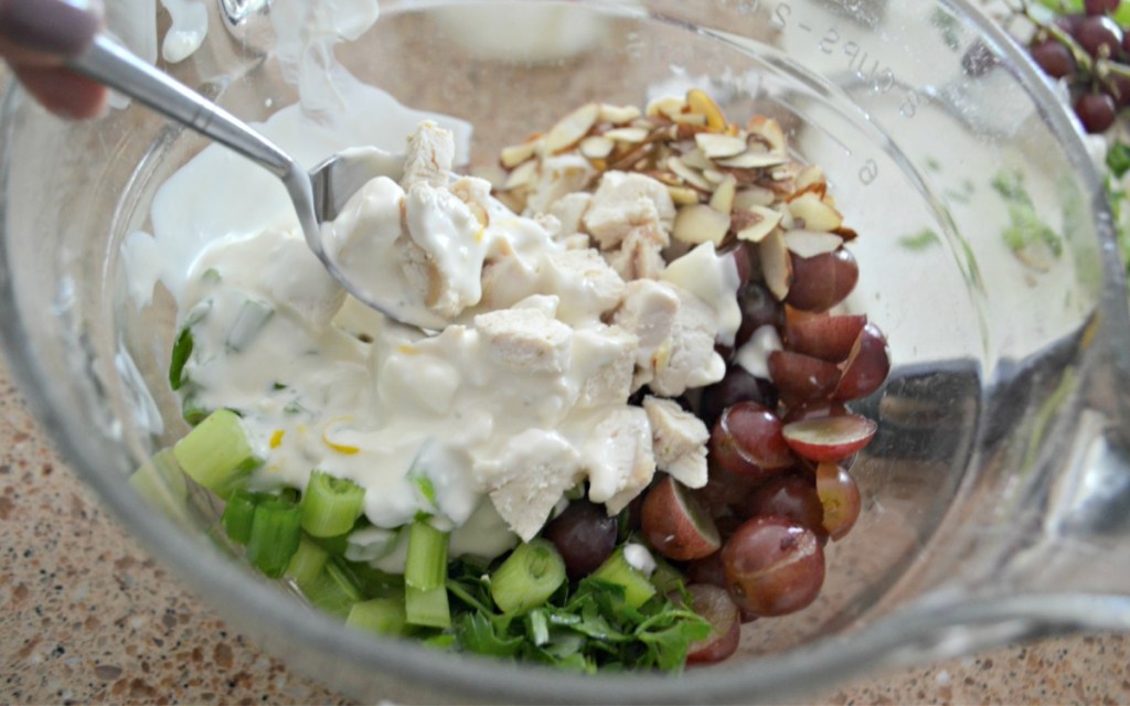 mixing chicken salad ingredients