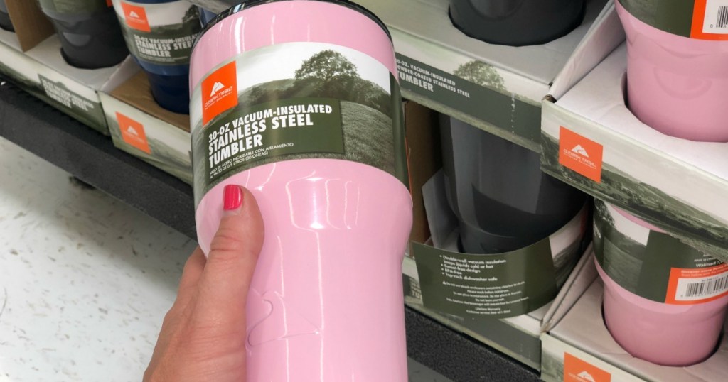 woman holding Ozark Trail Tumblers in store