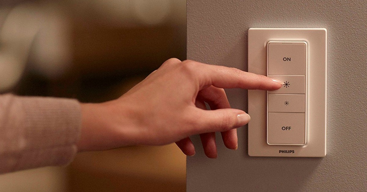 person moving switch on a Philips Hue Dimmer Switch Kit