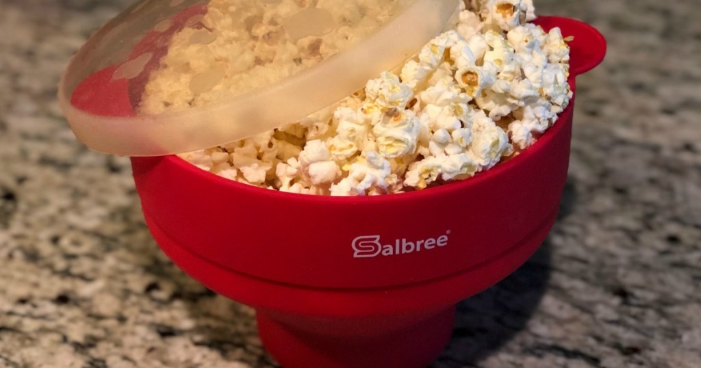 red popcorn bowl full of popcorn