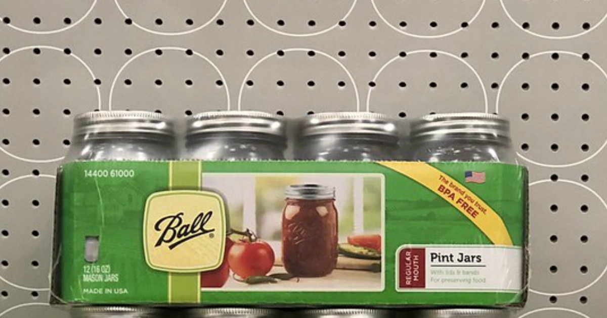 ball pint mason jars in packaging in front of a gray pegboard wall with white circles