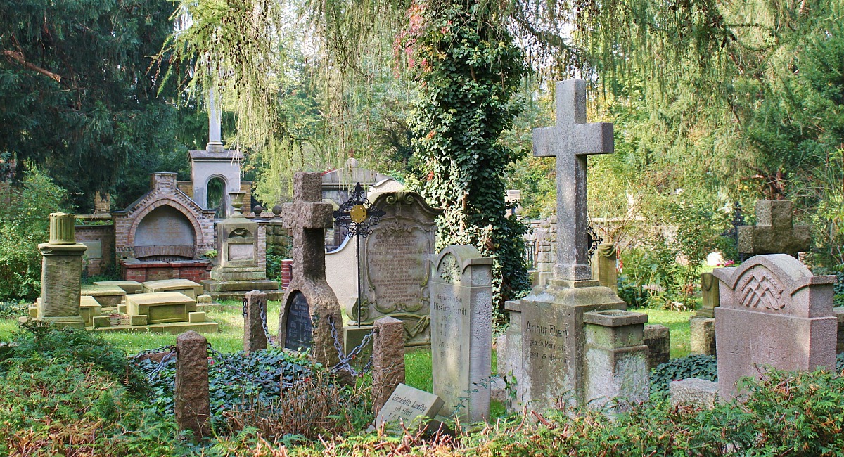places for free fun fall activities — cemetery with tombstones and fall foliage