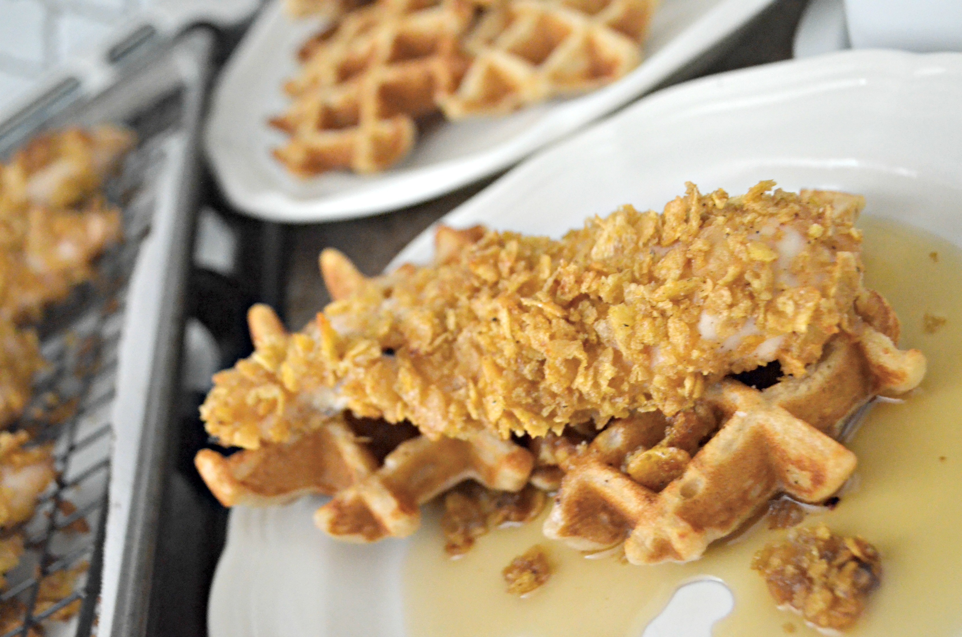 Easy Cornflake Chicken and Mini Waffles - closeup of chicken on a waffle