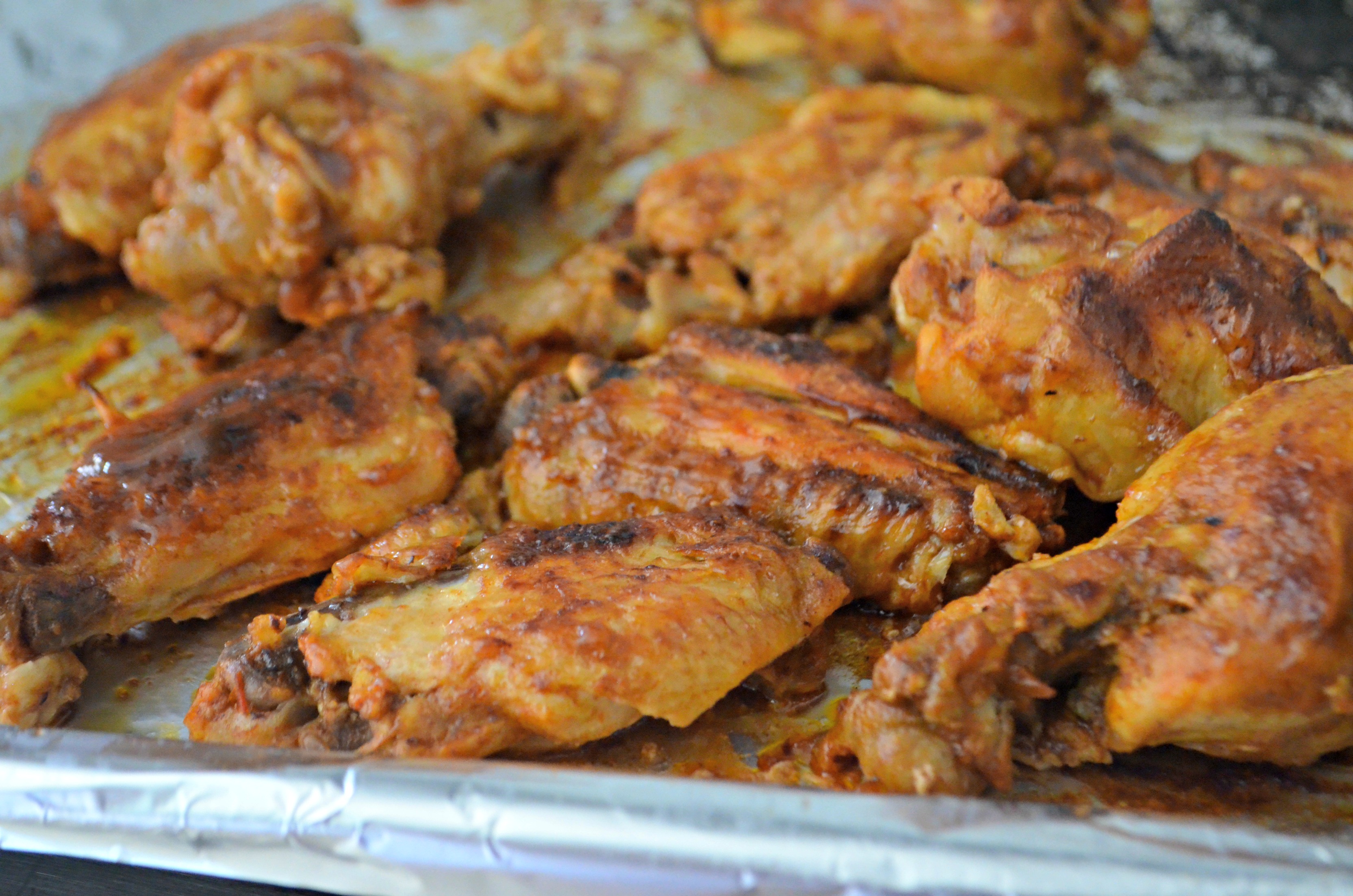 easy slow cooker buffalo bbq chicken wings - Wings on a pan after broiling briefly
