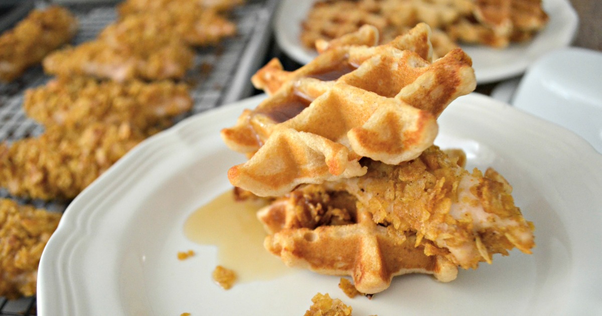 Easy Cornflake Chicken and Mini Waffles - plated as a sandwich with syrup