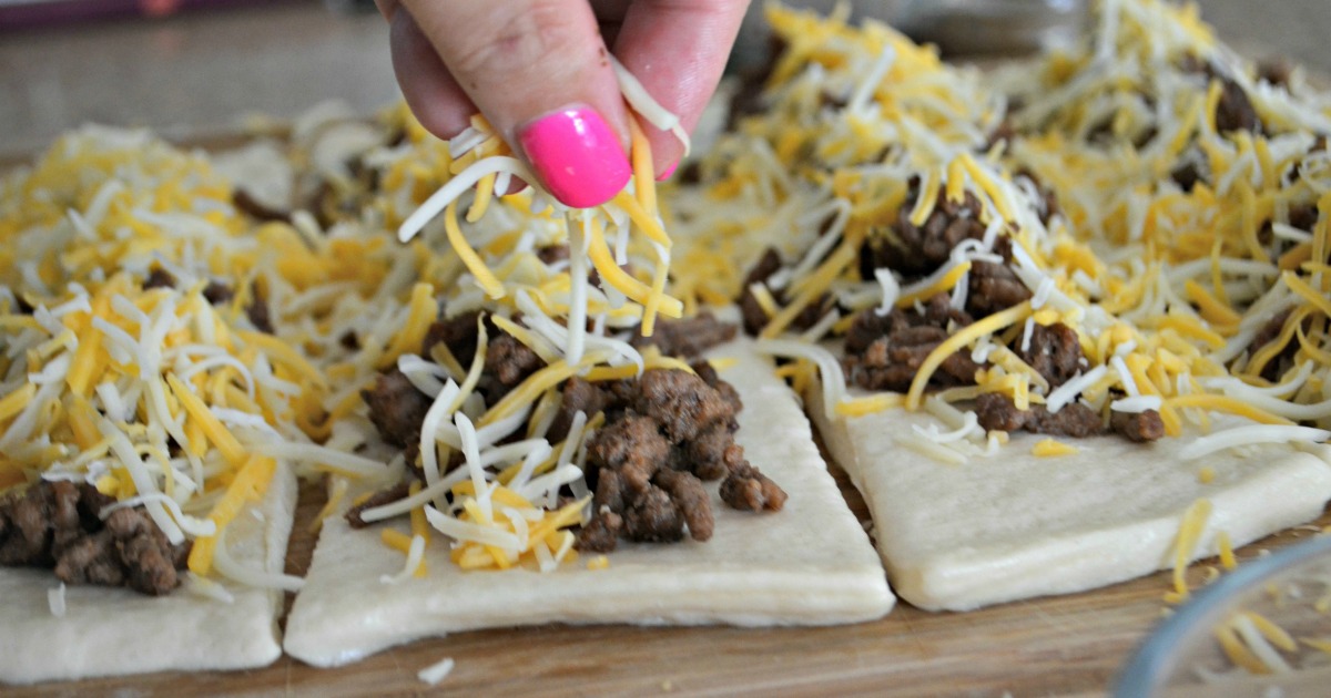 Easy 3 Ingredient Cheesy Taco Stuffed Breadsticks - adding the cheese