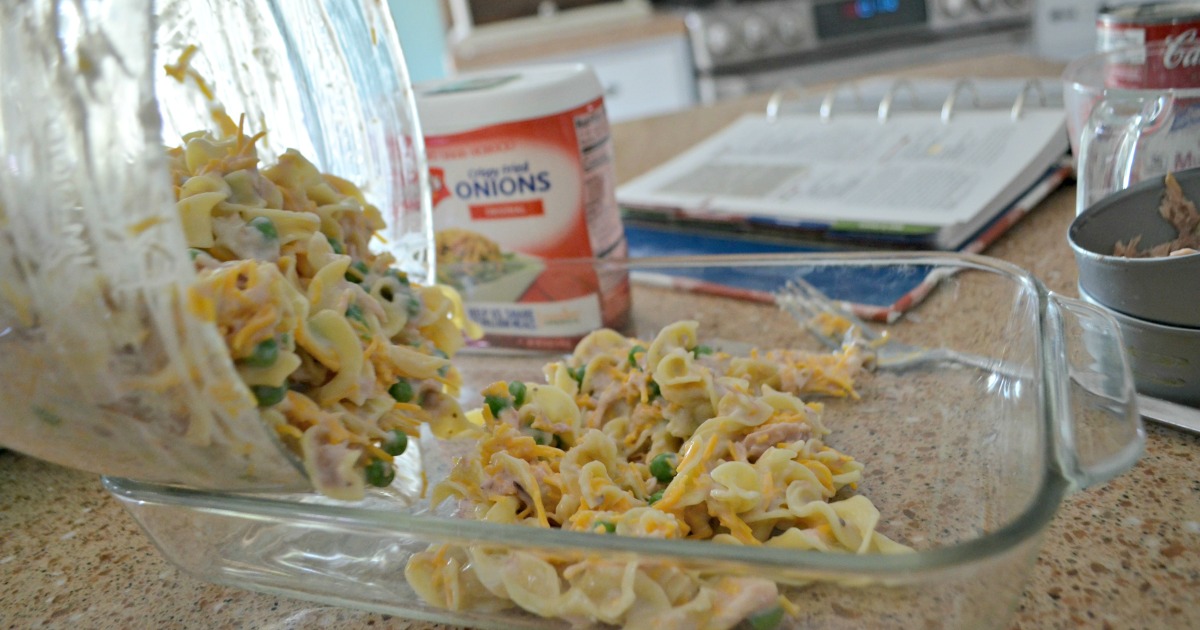 tuna noodle casserole is one of our favorite childhood recipes – Here, pouring ingredients into the baking dish
