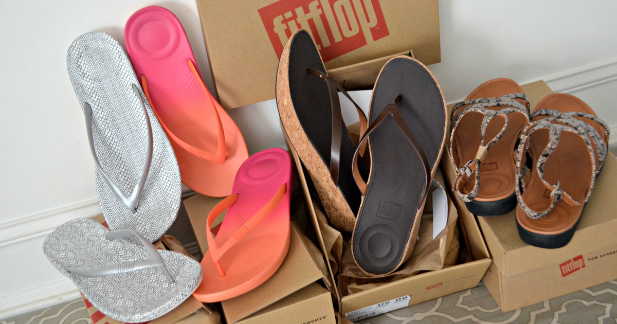 Fitflop shoes piled around fitflop boxes