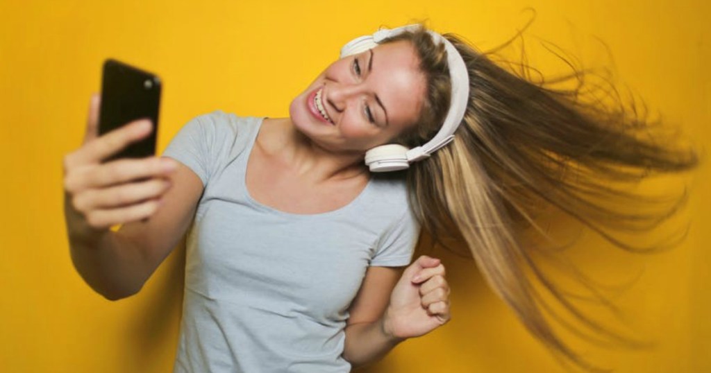 girl dancing with headphones on