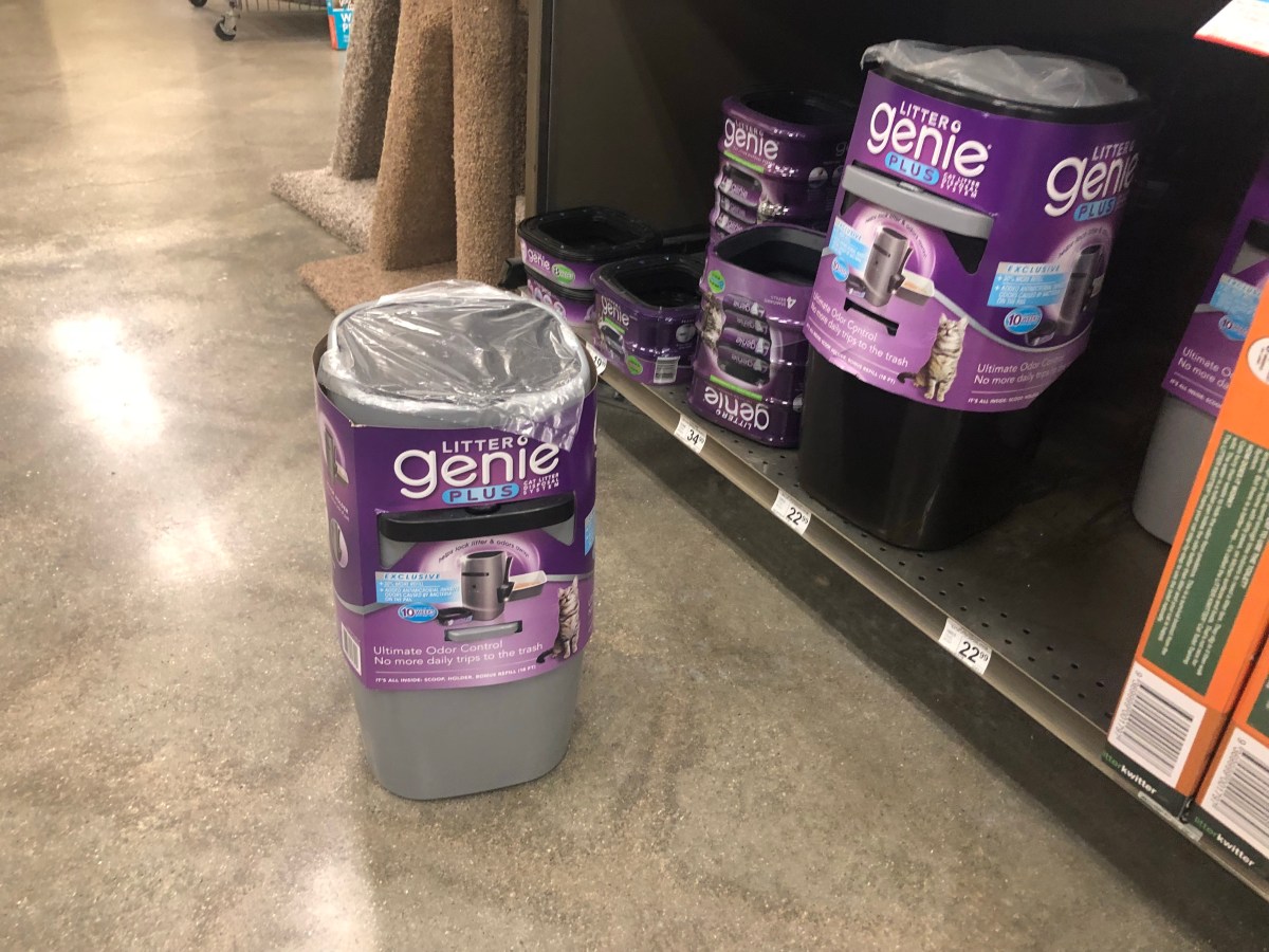 litter genie plus sitting on a floor and shelf in a store