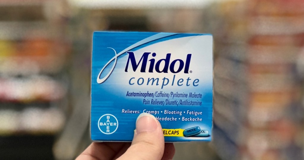 hand holding a box of Midol Complete Menstrual Period Symptoms Relief Caplets 40-Count