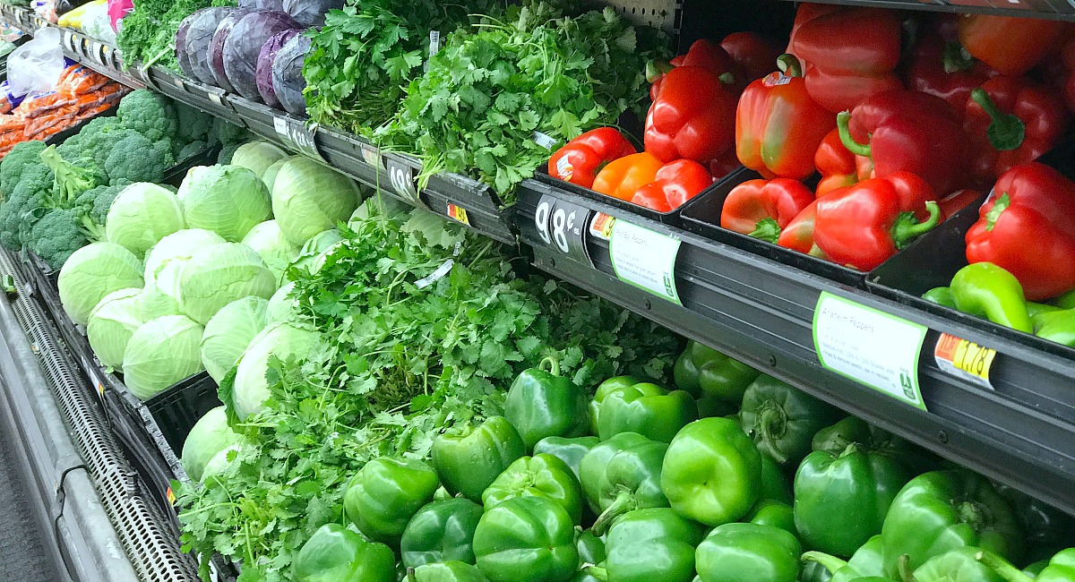 save money with these summer clearance sales – peppers and other produce in refrigerated bins