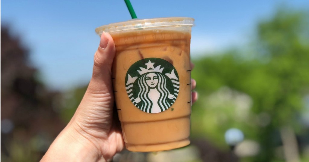 hand holding up a starbucks iced coffee