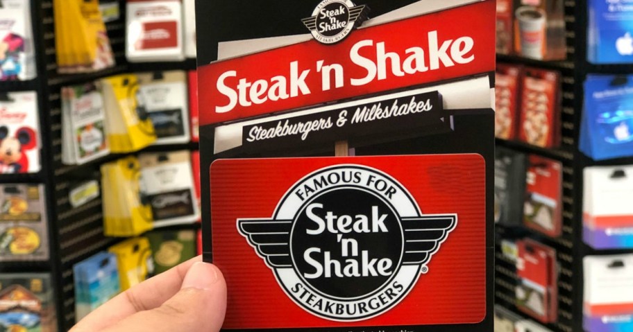 hand holding a steak n shake gift card