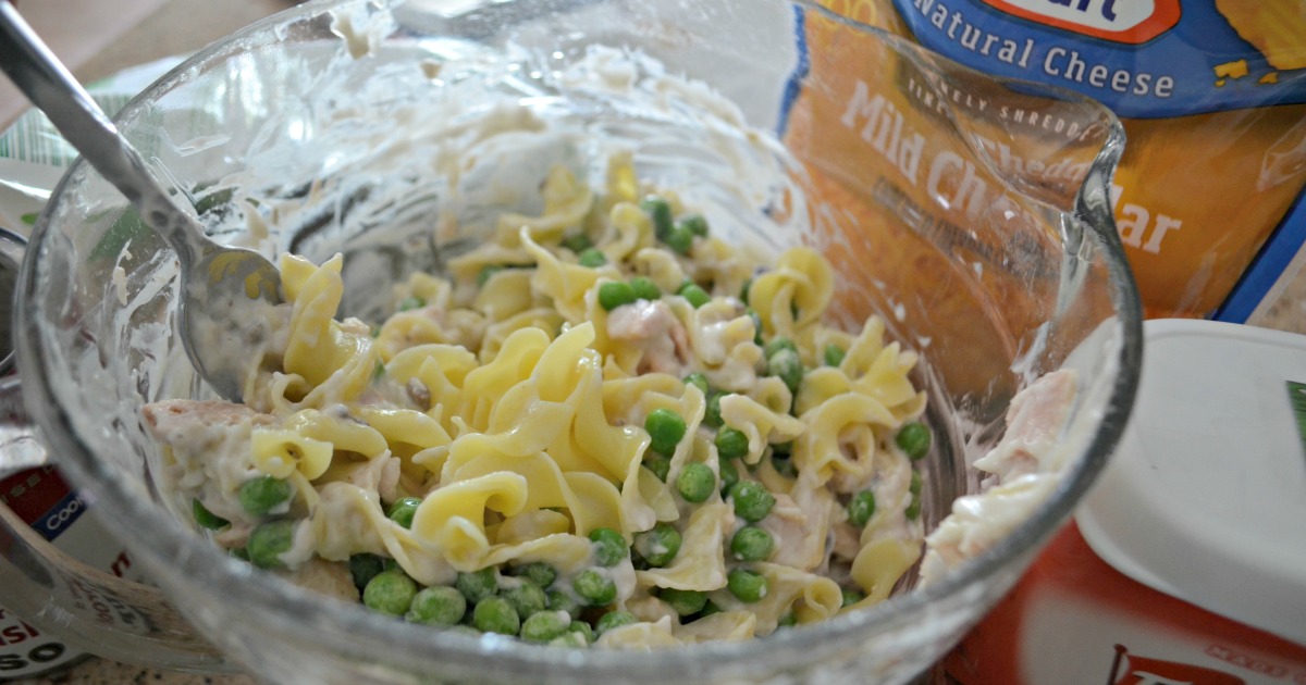 tuna noodle casserole is one of our favorite childhood recipes – Stirring ingredients in a bowl prior to baking
