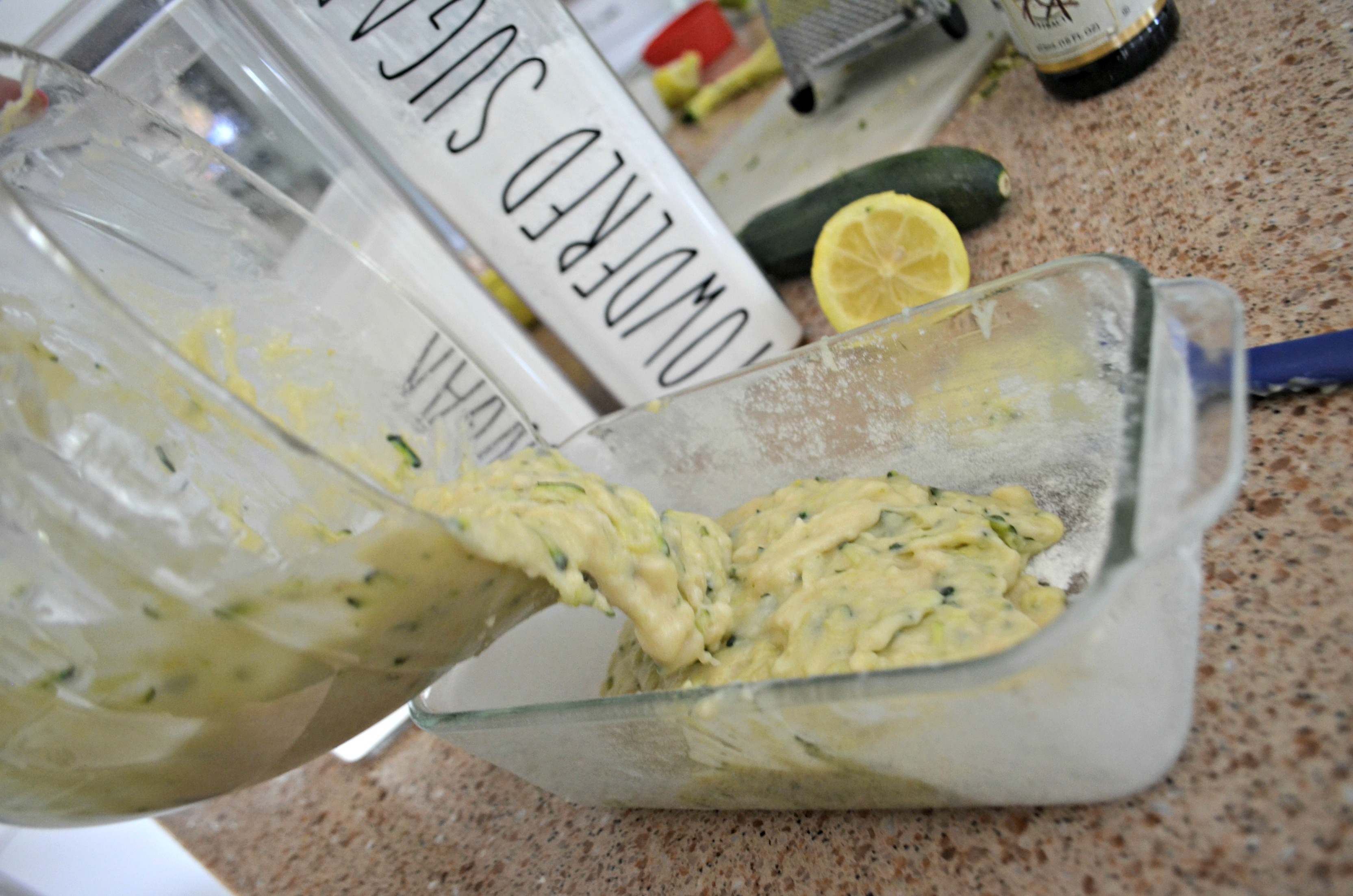 Pouring the lemon zucchini loaf batter into a baking pan