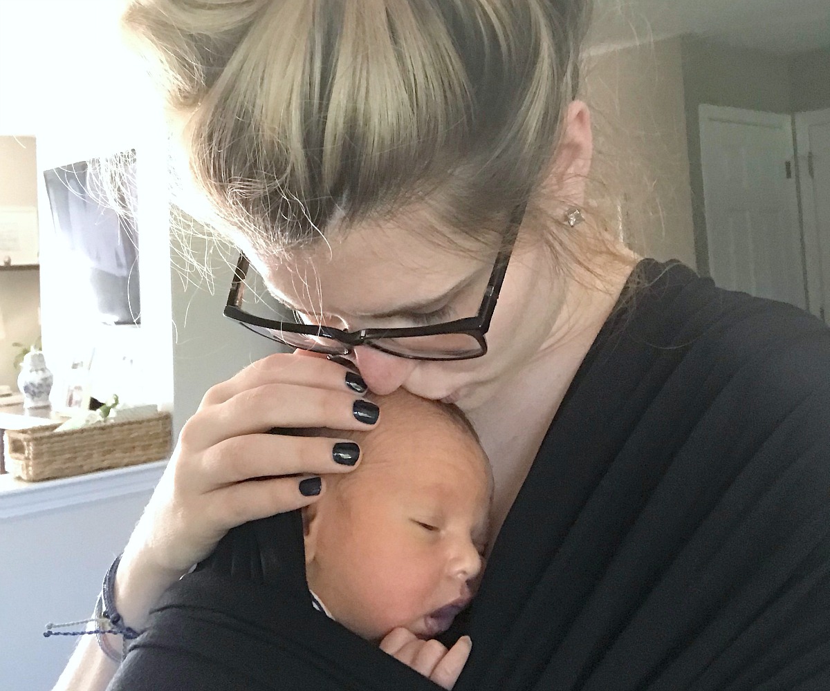 amber's organized meal plans and grocery shops — amber holding baby in baby carrier wrap