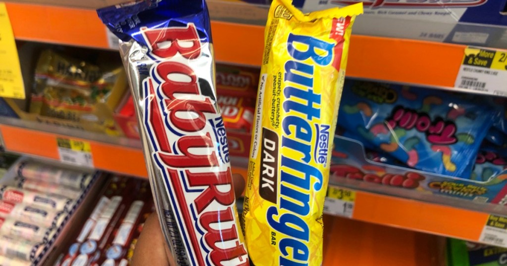 two candy bars in front of shelf 