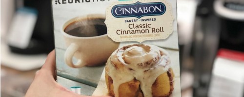 hand holding box of Cinnabon k-cups