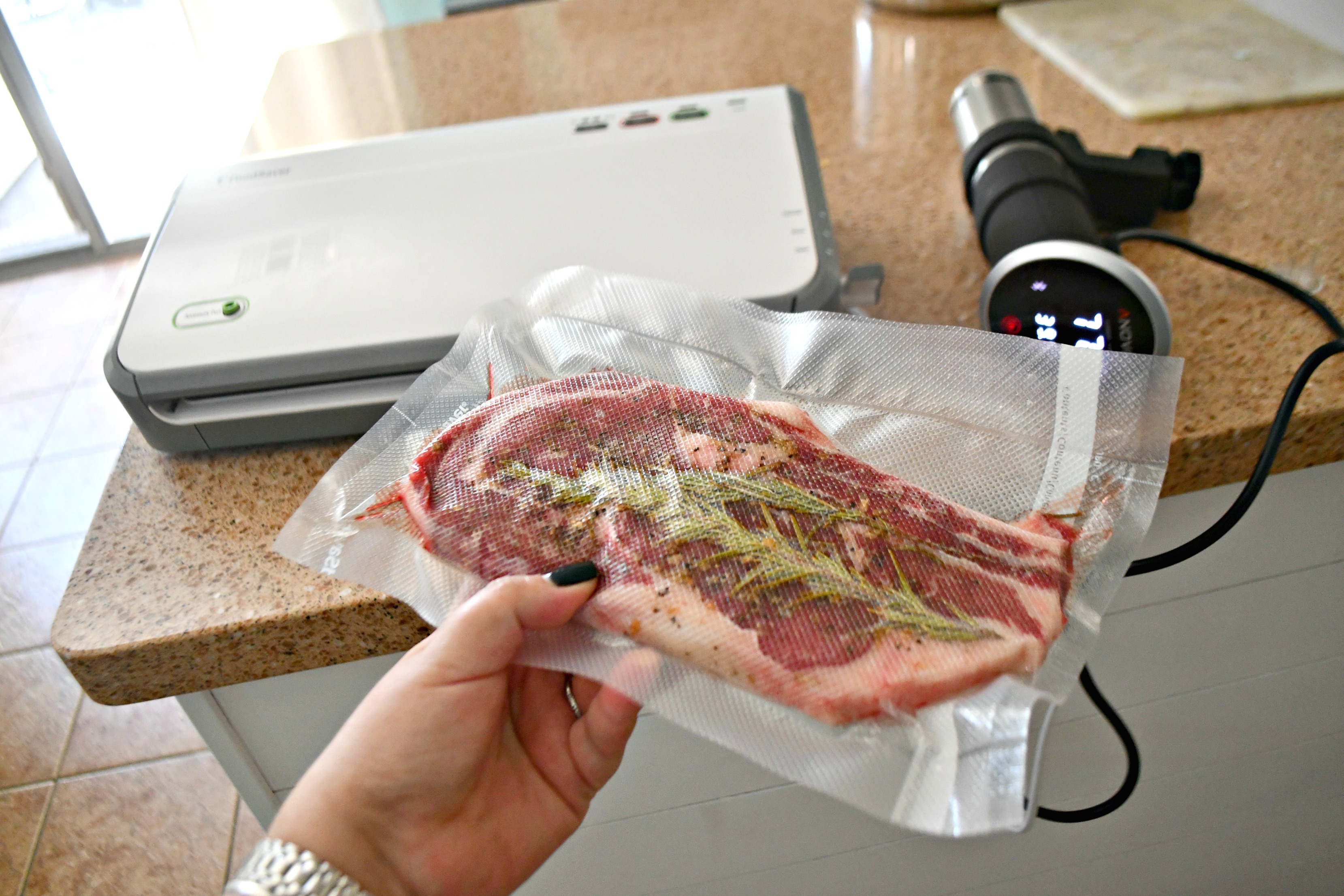 Make the Best Steak Using the Sous Vide method! Pictured here is a vacuum sealed steak with herbs