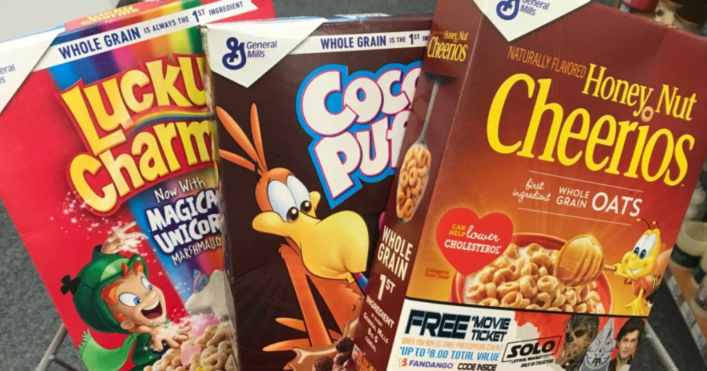 three boxes of cereal in cart