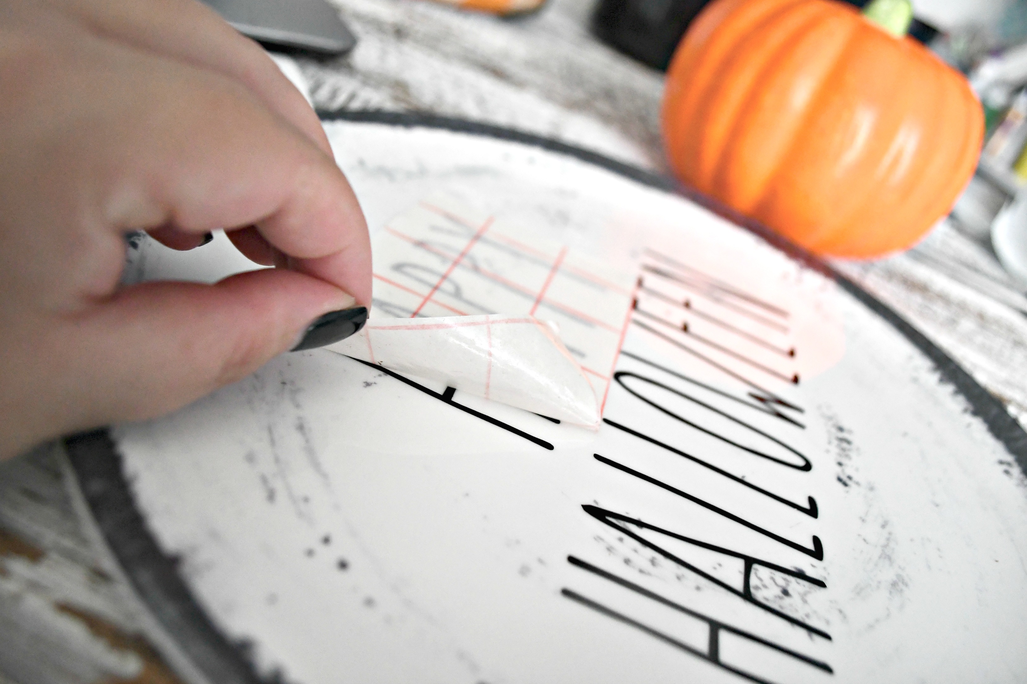 DIY Rae Dunn Inspired Halloween Decor - transferring the lettering to a plate