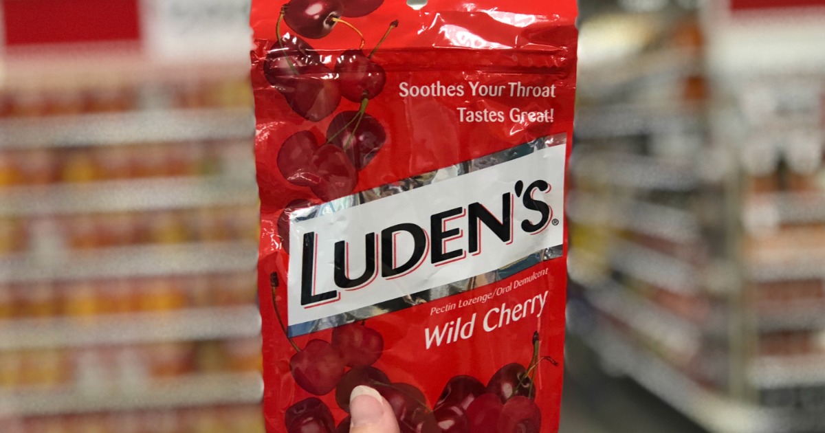 hand holding luden's wild cherry throat drops store