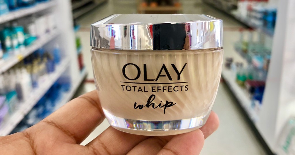 hand holding olay total effect whip jar