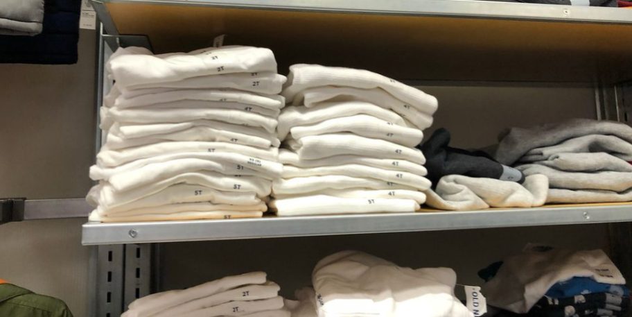 boys shirts folded on shelf in old navy store