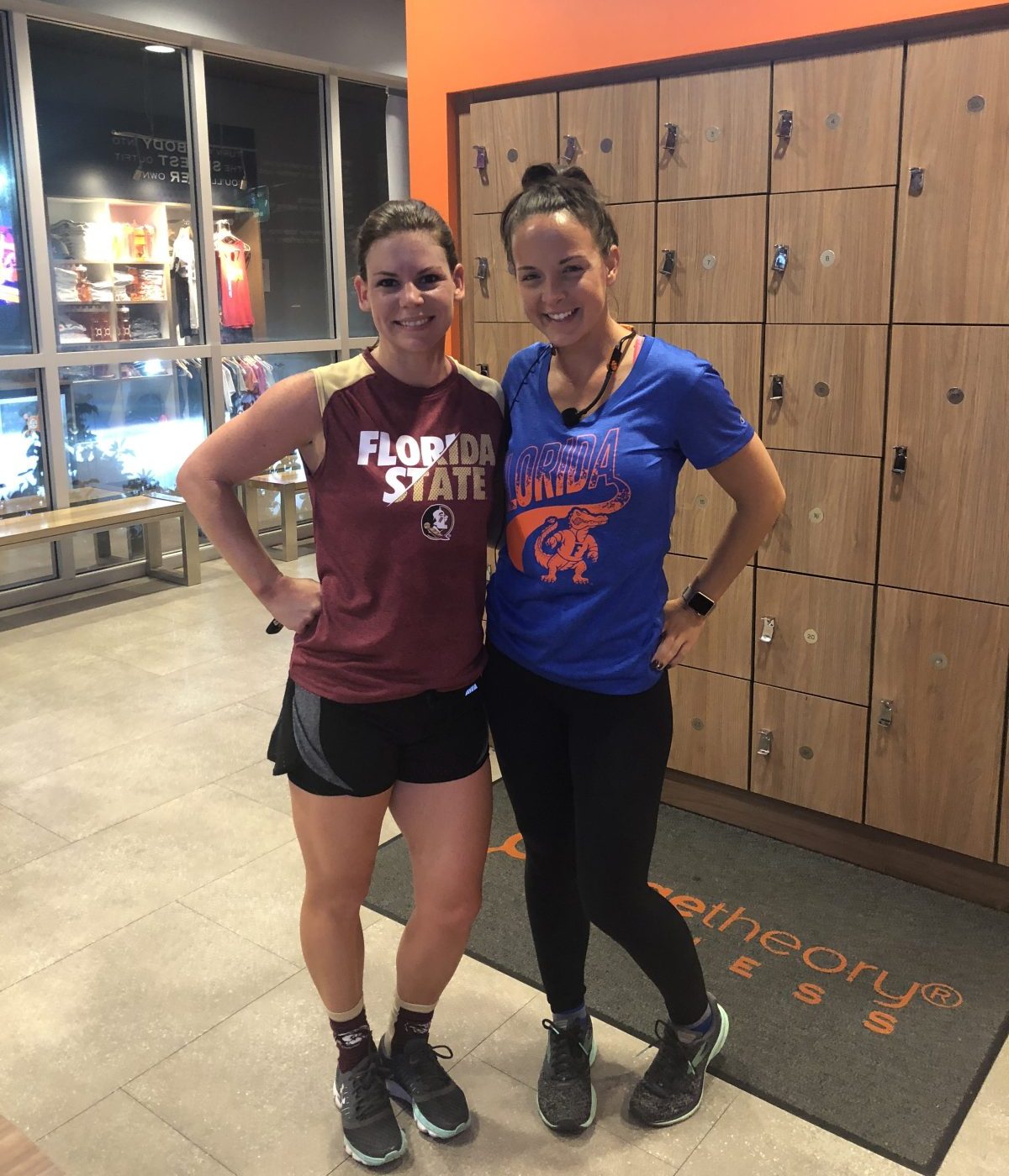 Erica with her Orange Theory Fitness Coach in the locker room