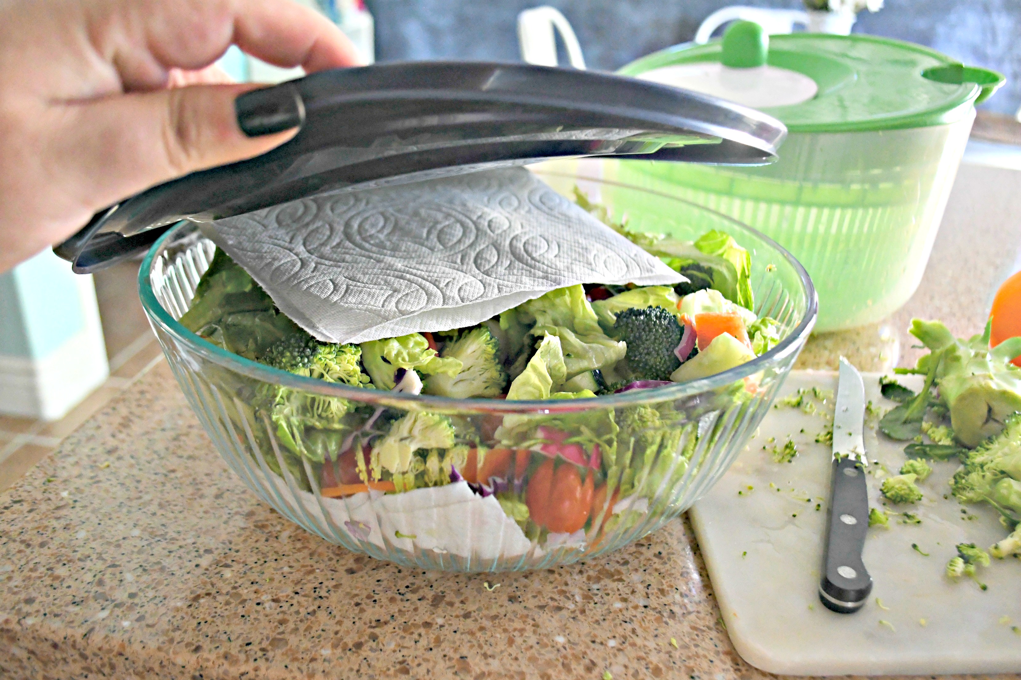 Storing my Weekly Sunday Salad Prep and my favorite dressing recipe in a glass storage container.