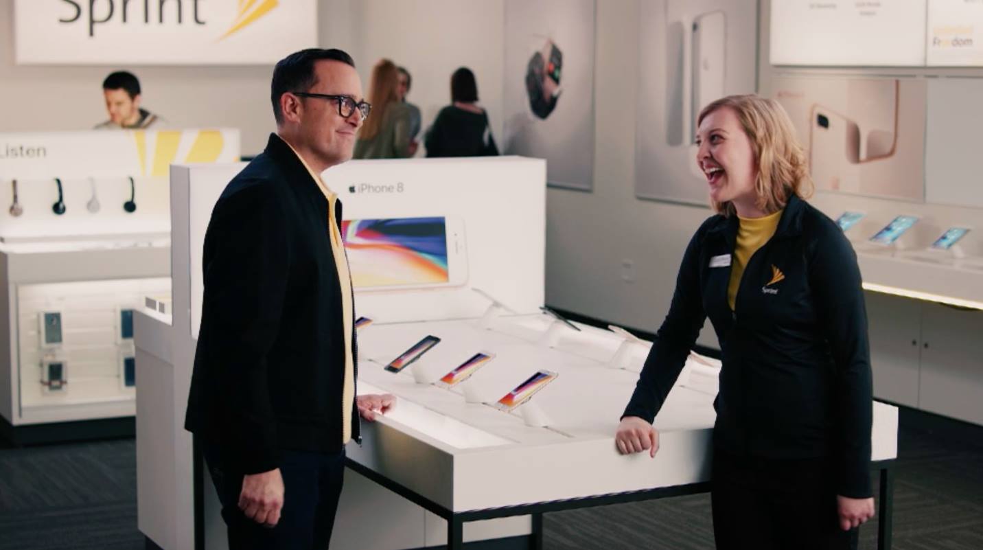 New iPhone XS is available for pre-order - here's how to save money - Sprint store employee helping customer