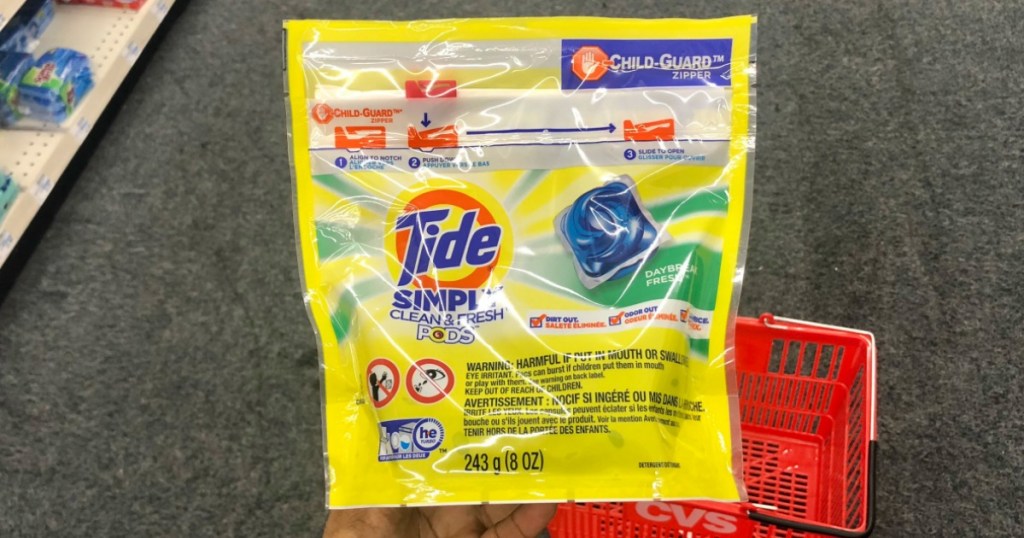 hand holding bag of Tide PODS Simply