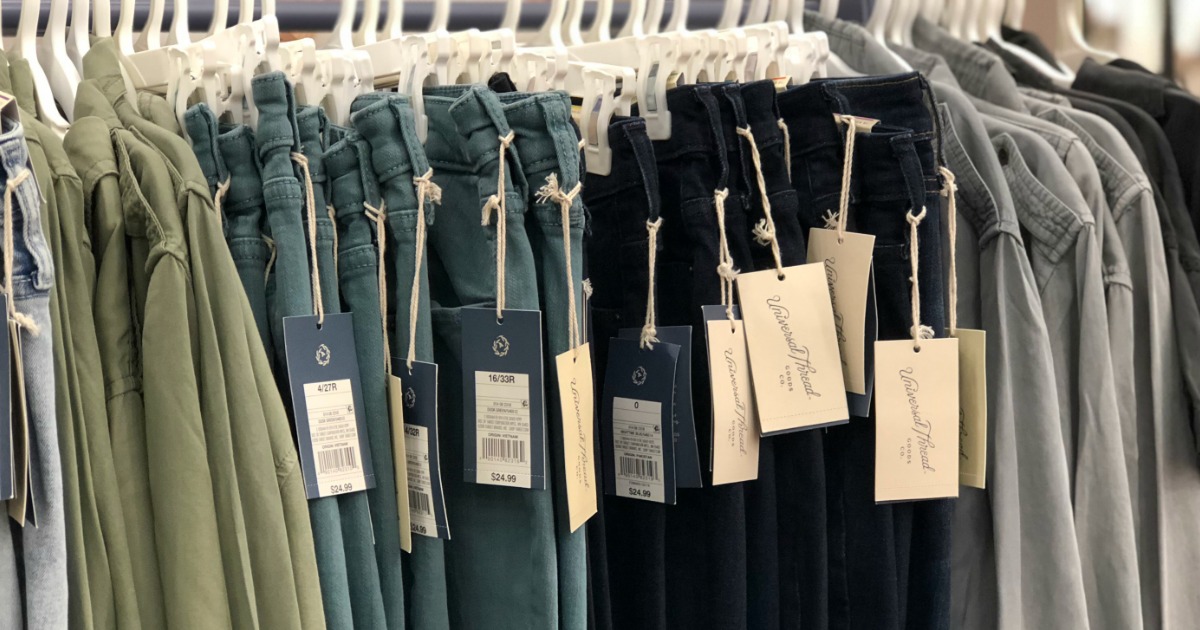 Rack of Universal Thread Jeans with tags hanging