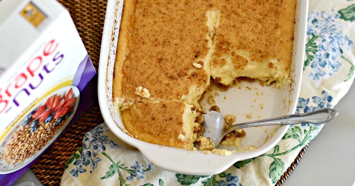 Classic Grape-Nuts Pudding in the bakeware with a serving spoon