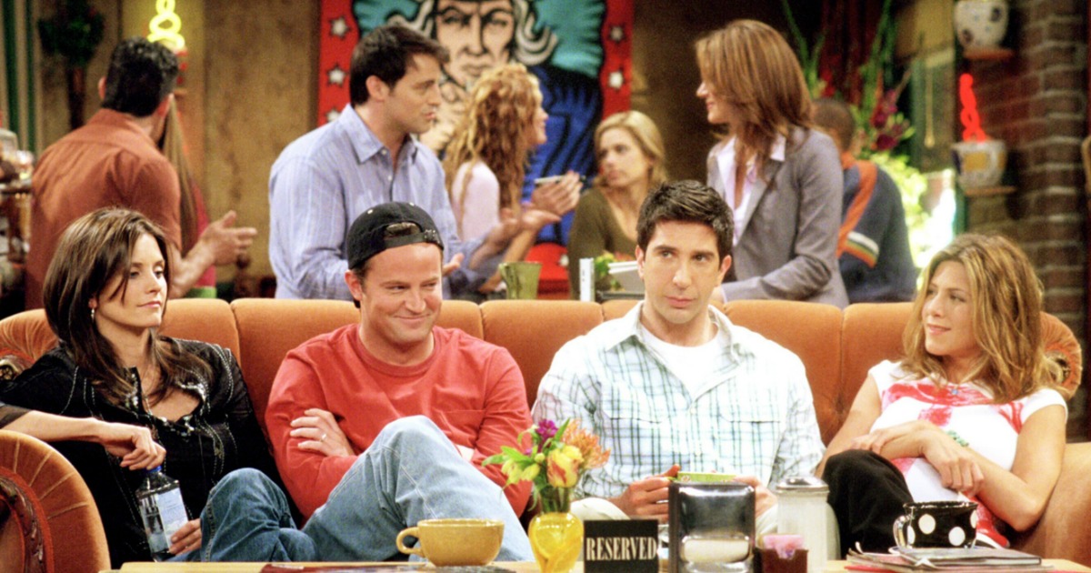 cast of Friends sitting on a couch at Lucky Perk