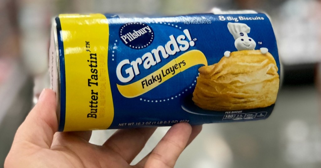 hand holding tube of pillsbury grands biscuits