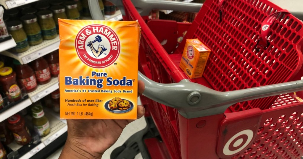hand holding FREE $3 FandangoNOW Code w/ Purchase of Two Arm &amp; Hammer Baking Soda Products