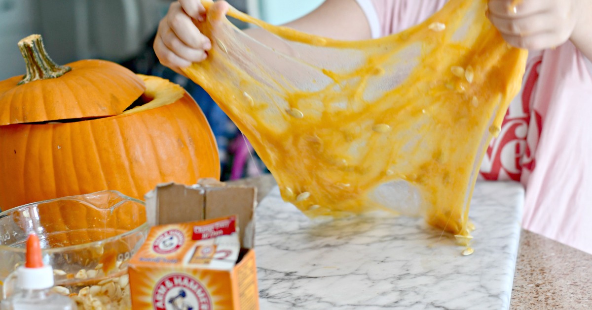 DIY Pumpkin Guts Slime – the slime being pulled apart
