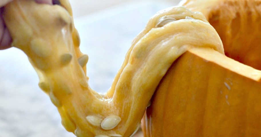 diy pumpkin guts slime in a pumpkin