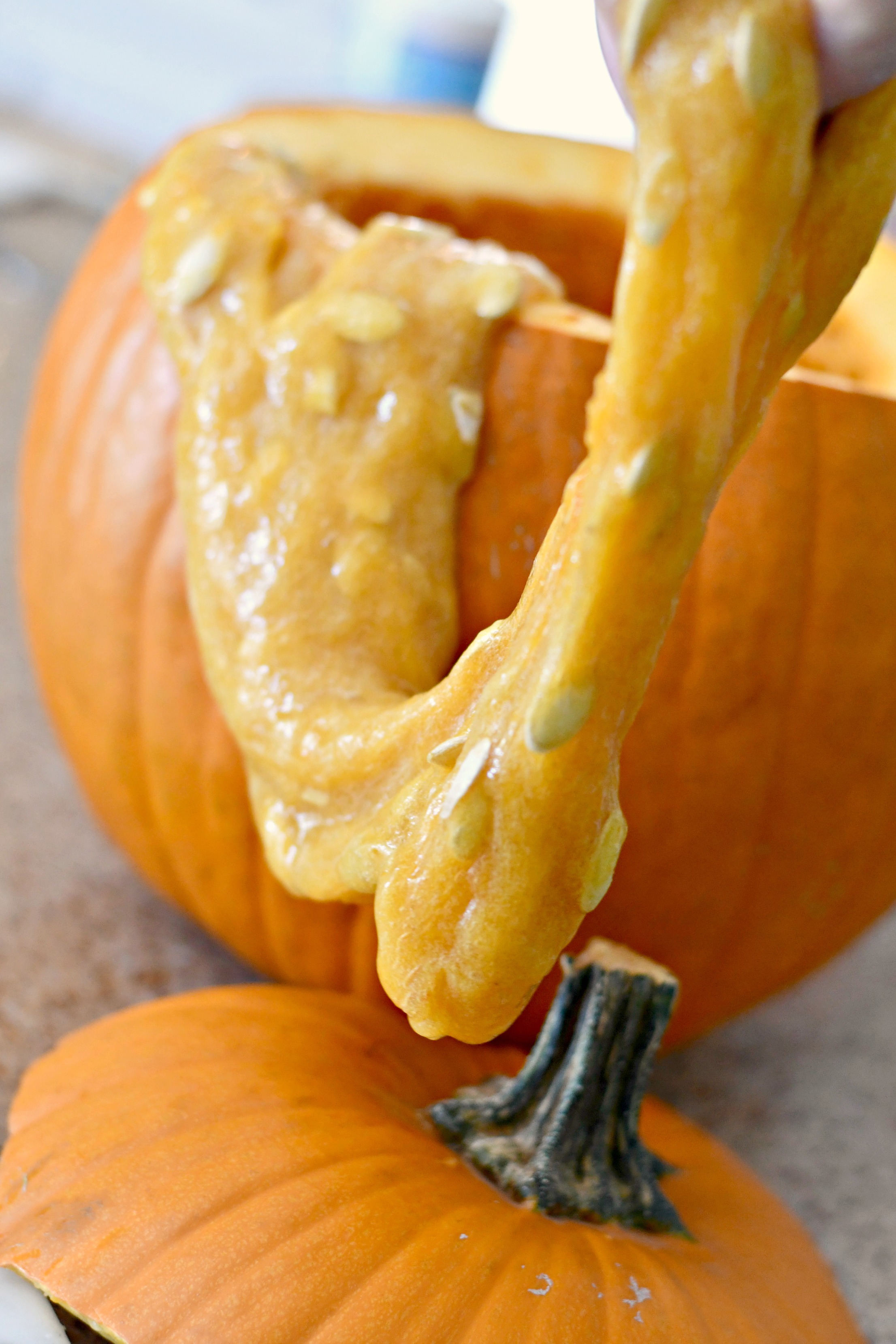 DIY Pumpkin Guts Slime – the slime pouring out of a pumpkin