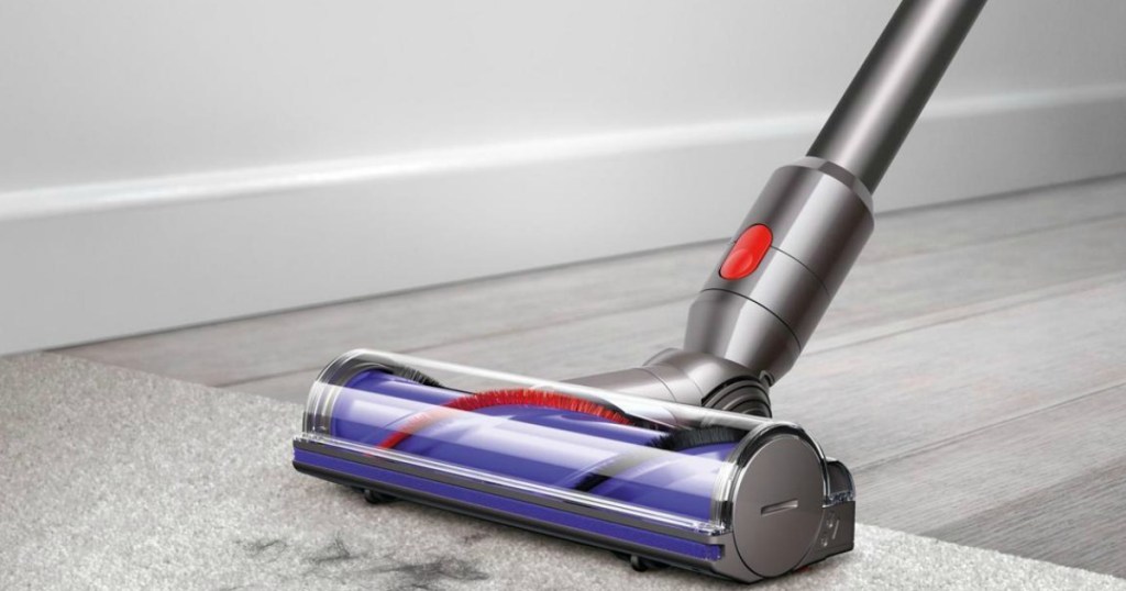 dyson stick vacuum vacuuming hair up from carpet