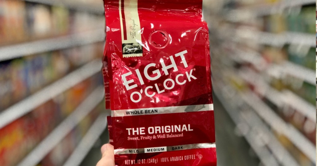 hand holding Eight O Clock Coffee