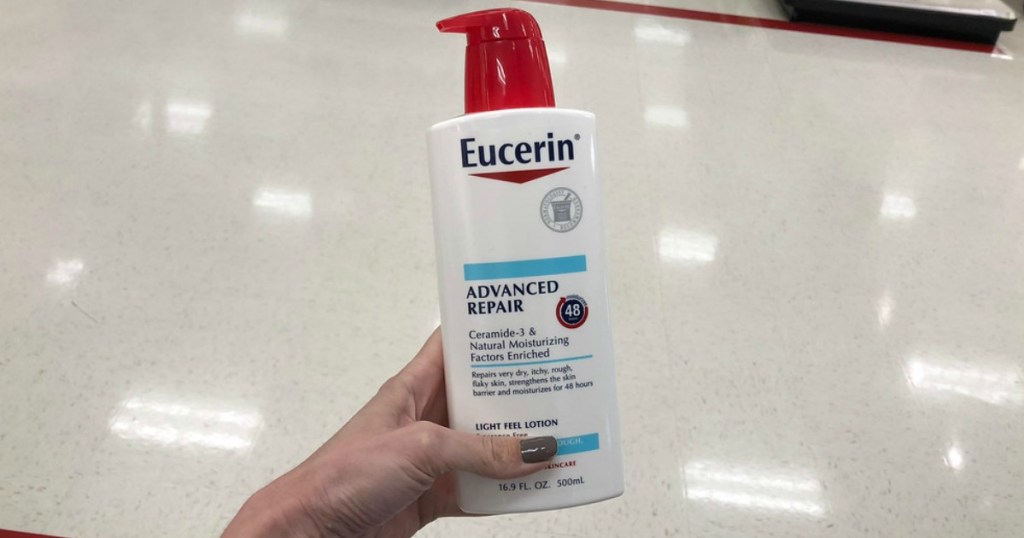 hand holding eucerin advance repair lotion